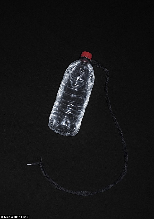 Attempting to survive: Water bottle with loop, owned by Benjamin Chavarrie, 40, which serves to carry water while traveling on the roof of the Beast