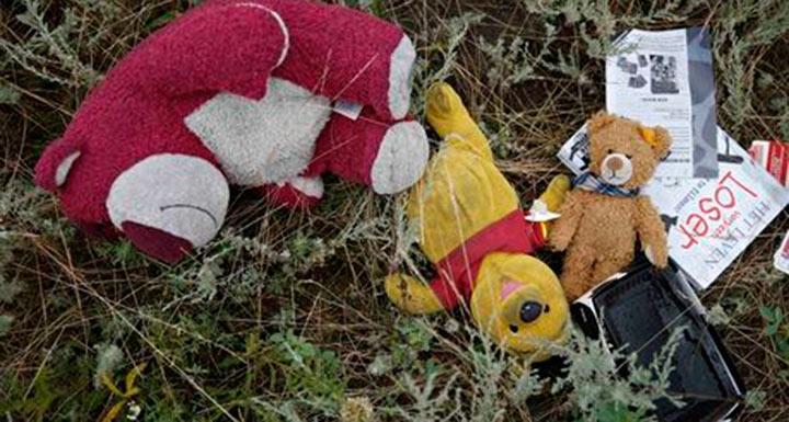 A child's belongings from the MH17 crash: 'Images such as these can be as heartbreaking a sight as the body-bagged corpses that once owned them.' Photograph: Maxim Zmeyev/Reuters