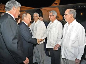 Vladimir Putin shown arriving in Havana and received by Foreign Ministry official. (Photo from Granma)