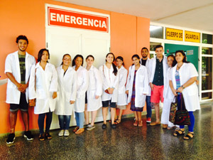 Photo: Courtesy of Elizabeth Amaya-Fernandez Students in front of a health clinic they visited in Cuba.