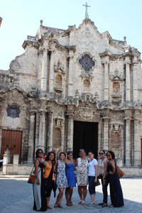 Photo: Courtesy of Connie Villanueva Elizabeth Amaya-Fernandez (center) with the students in front of the National Cathedral in Havana.