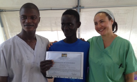 An Ebola survivor with a certificate of discharge. Photograph: Natasha Lewer