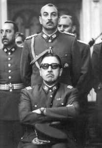 Augusto Pinochet shown seated.