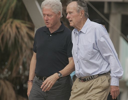 In this Oct. 14, 2008 file photo, former Presidents Bill Clinton and George Bush walk on the beach in Galveston, Texas. Again? Really? There are more than 300 million people in America, yet the same two families keep popping up when it comes to picking a president. The possibility of a Bush-Clinton matchup in 2016 is increasingly plausible. After months of hints and speculation, former Florida Gov. Jeb Bush last week said he's actively exploring a bid for the Republican nomination. And while Hillary Rodham Clinton hasn't revealed her intentions, she's seen as the odds-on favorite for the Democratic nomination. (AP Photo/Pat Sullivan, File)