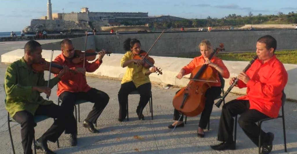 Musicians from the National Symphony Orchestra rehearsing outdoors in Havana.