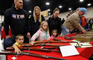  Children being taken by their parents to a gun show.