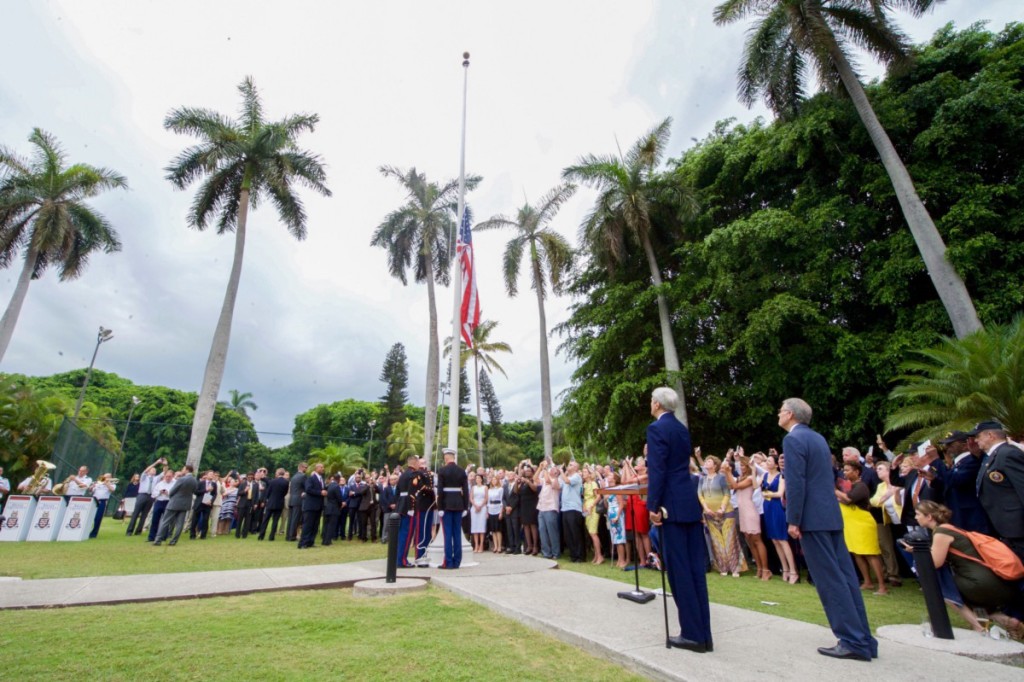 U.S. Secretary of State John Kerry and Chargé d’Affaires Jeffrey DeLaurentis watch as Marines raise the American flag at the Ambassador’s residence in Havana, Cuba, on August 14, 2015. [State Department photo / Public Domain]
