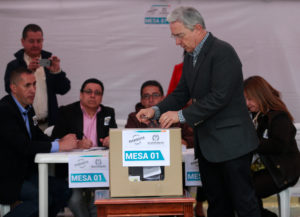 Colombia's former President Alvaro Uribe casts his vote for referendum on a peace deal between the government and Revolutionary Armed Forces of Colombia (FARC) rebels, at Bolivar Square in Bogota, Colombia, October 2, 2016. REUTERS/John Vizcaino