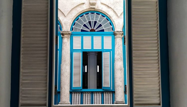 08-Havana-Architecture-Urban-Exploration-Isobel-McKenzie-Editor-Nonagon-Style-N9s-window-view-blue-courtyard-columns-shutters